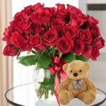 Red Roses in Vase with Teddy Bear